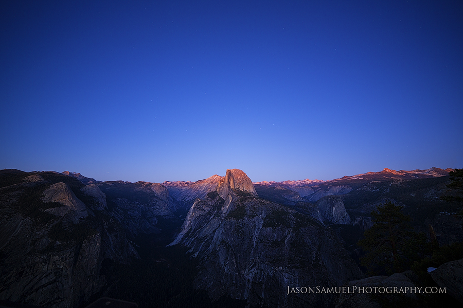 Yosemite Half Dome at golden hour with dramatic valley light