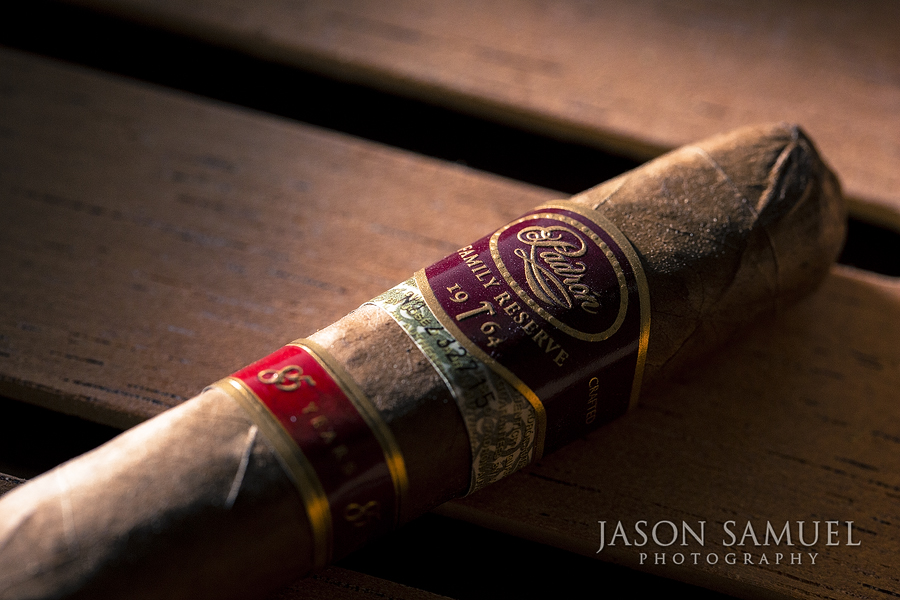 Padron premium cigar — macro product photography with warm tones
